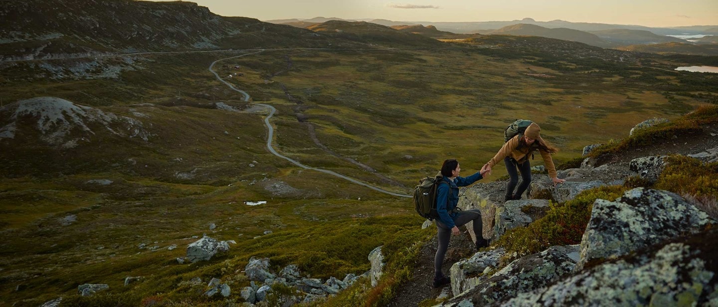 People hicking in rocky landscape