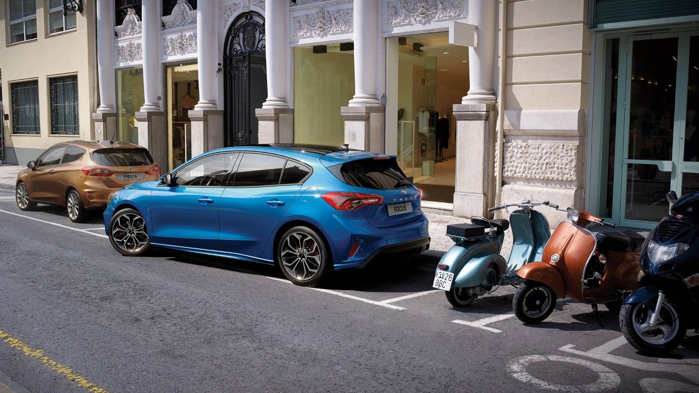 Blue Ford Focus parallel parking