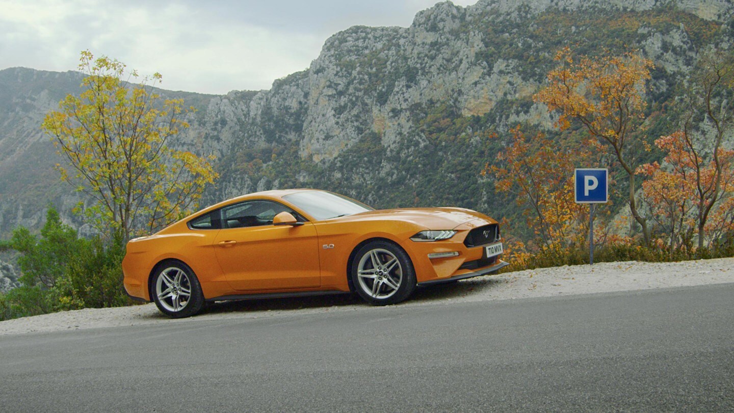 Ford Mustang driving up hill