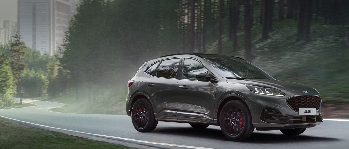 Ford Kuga driving out of a city Ford Kuga driving out of a city