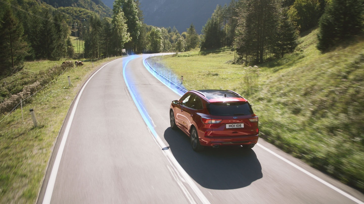 All new Ford Kuga driving on road showing lane keeping