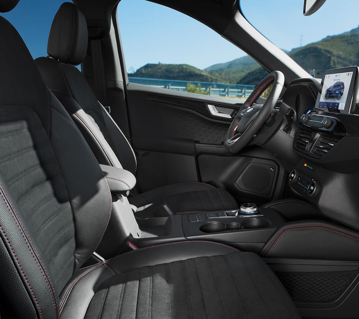 All New Ford Kuga interior showing steering wheel, SYNC3 and leather seats