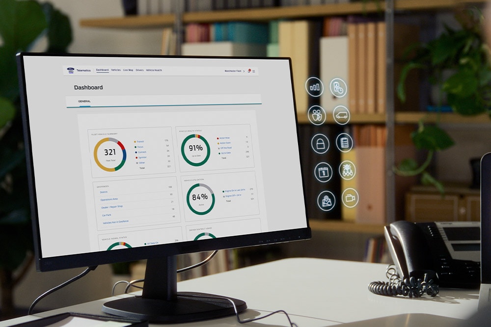 L'écran d'un ordinateur affiche le tableau de bord de Ford Pro Telematics avec différentes mesures de performance de la flotte.