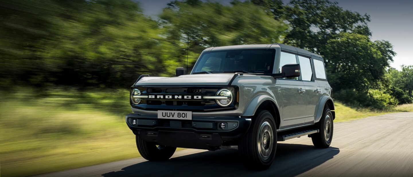 Ford Bronco driving through the road Ford Bronco driving through the road