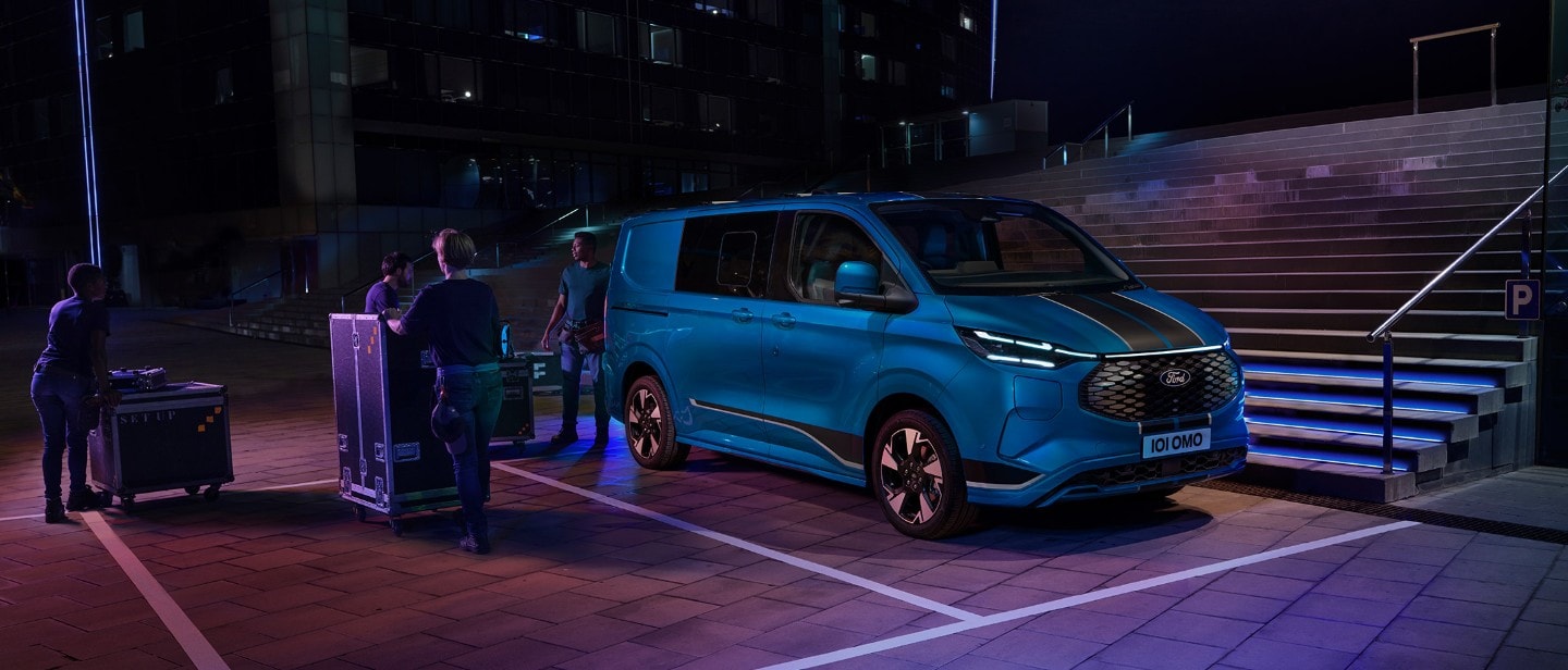 Ford Transit Custom Sport in blue in front of staircase Ford Transit Custom Sport in blue in front of staircase