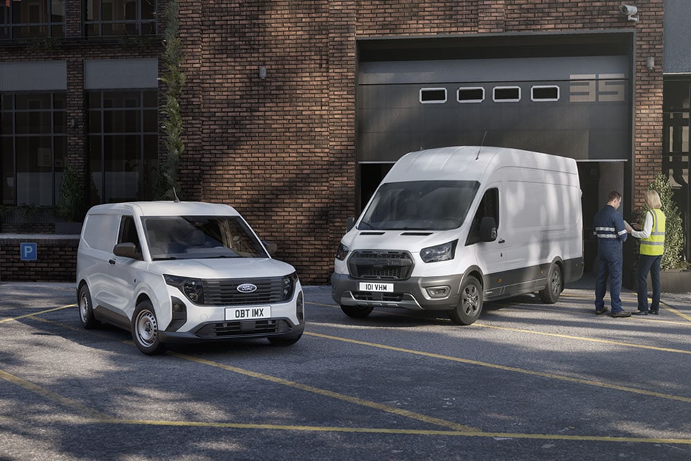 A small fleet including a white Ford Transit van and Transit Connect, parked outside a modern building.