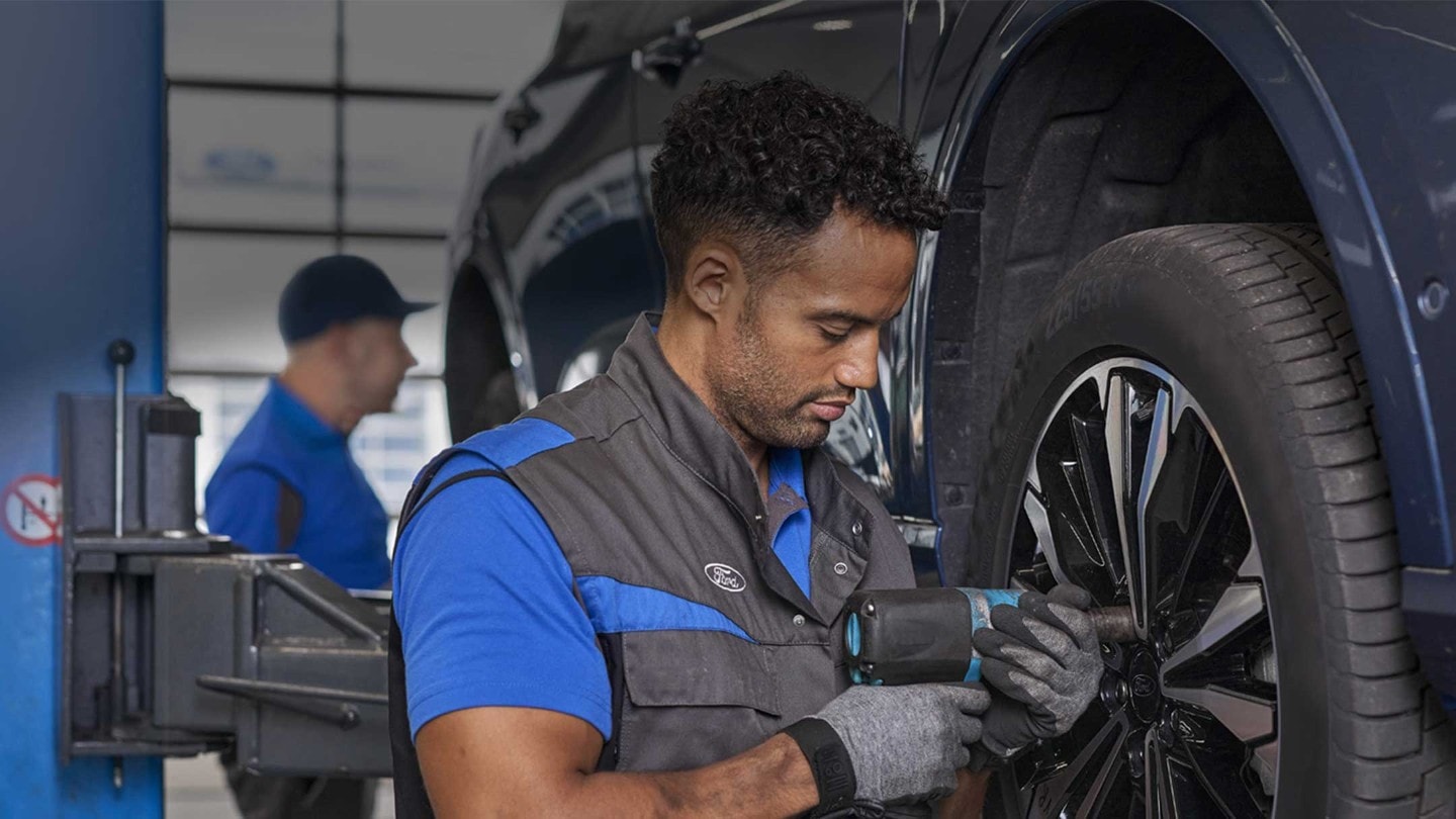 Technician changing tire